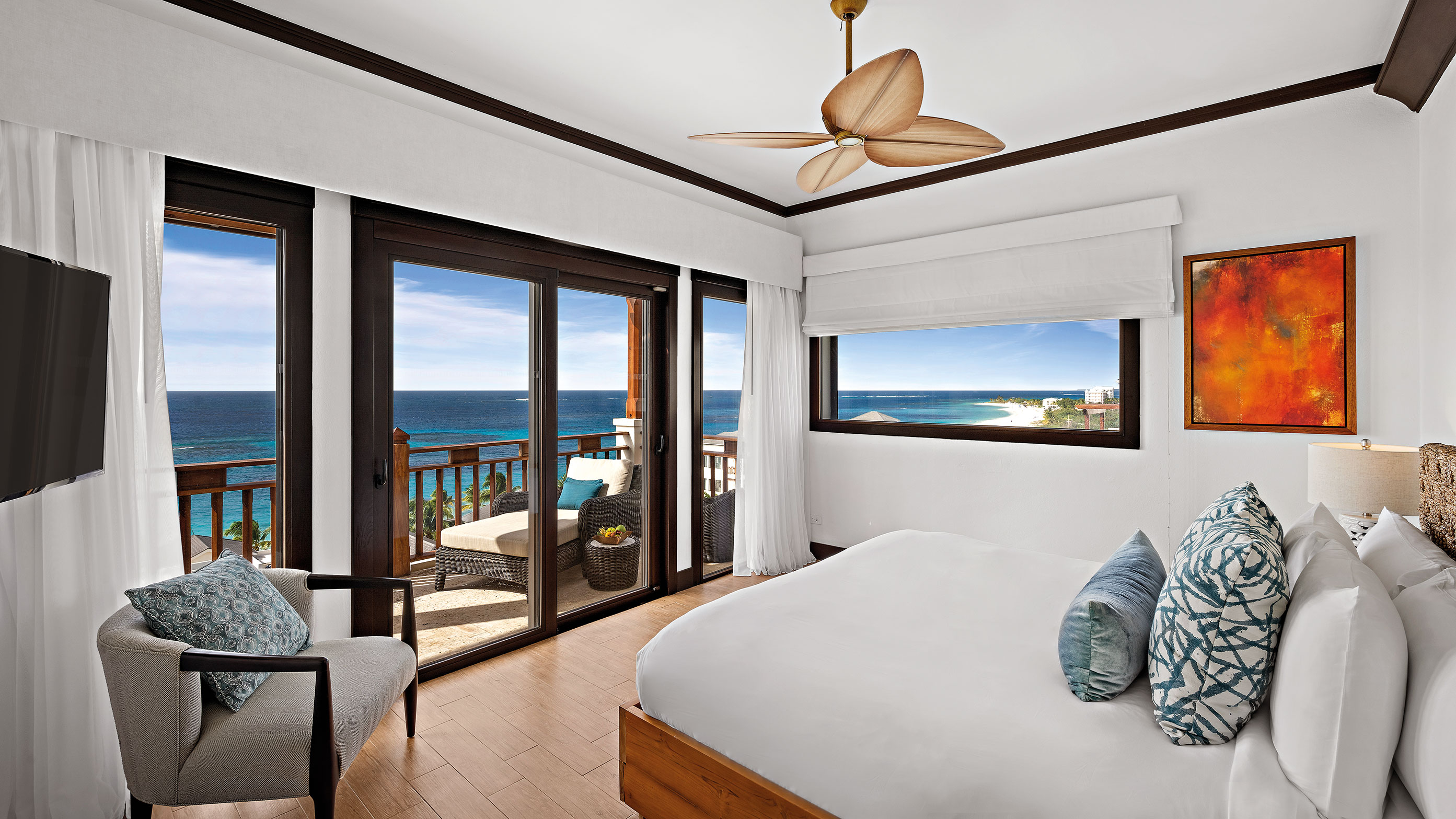 King bed facing balcony window and ocean